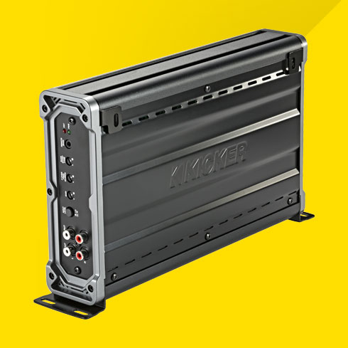 Side view of vertically mounted KICKER CXA1200.1 car amplifier showing control panel and RCA inputs.