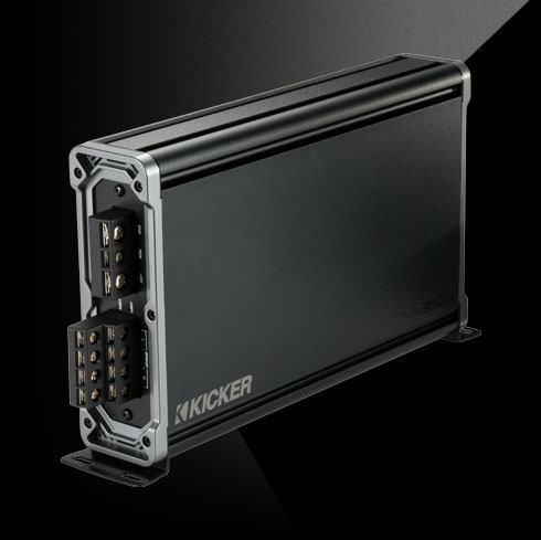 Angled side view of KICKER CXA360.4 car amplifier showing terminal block connections.