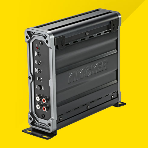 Side view of vertically mounted KICKER CXA400.1 car amplifier showing control panel and RCA inputs.