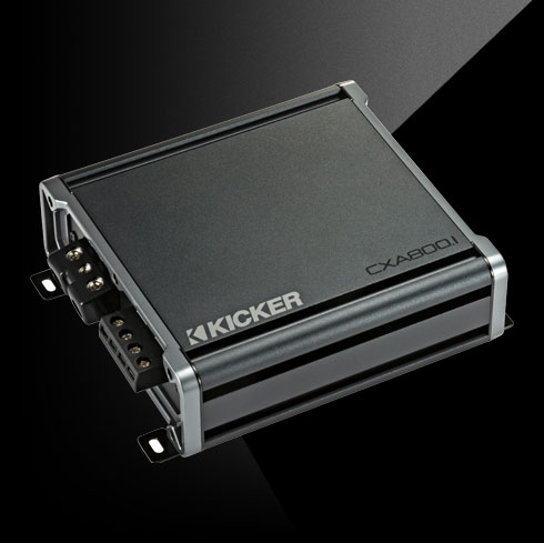 Angled top view of KICKER CXA800.1 car amplifier showing compact chassis and terminal connections.