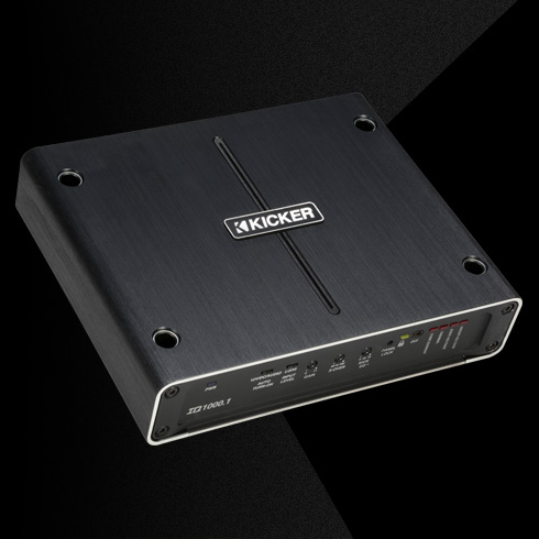 Angled top view of KICKER IQ1000.1 amplifier with brushed metal finish and front control panel.