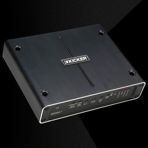 Angled top view of KICKER IQ500.1 amplifier with brushed metal finish and front control panel.