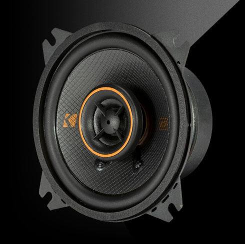 KICKER KSC40 4-inch coaxial speaker with black polypropylene cone, orange-trim tweeter, and thin-mount design.