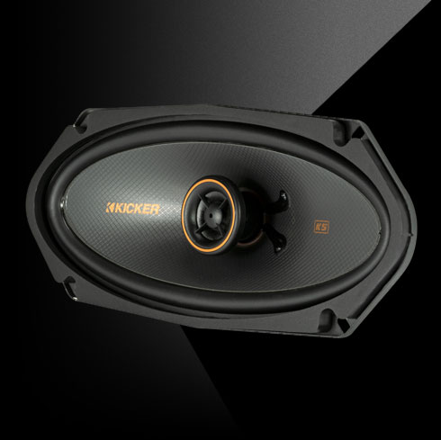 KICKER KS-Series 4x10-inch coaxial speaker with a black cone and orange accent ring, designed for powerful, detailed sound.