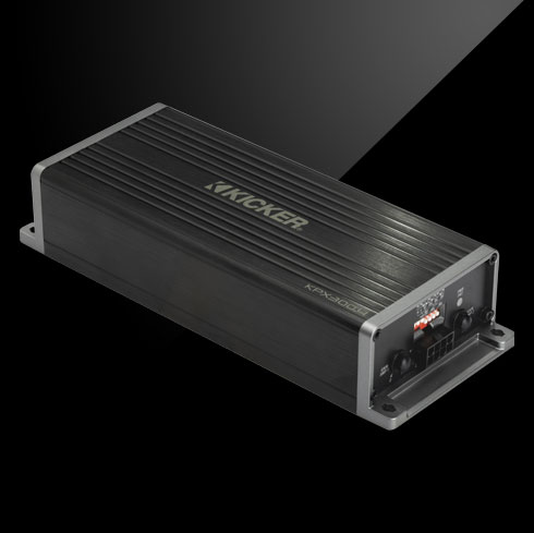 Angled view of KICKER KPX300.2 amplifier with ribbed black casing and visible rear connection ports.