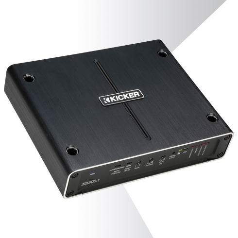 Angled top view of KICKER IQ500.1 amplifier with brushed metal finish and front control panel.