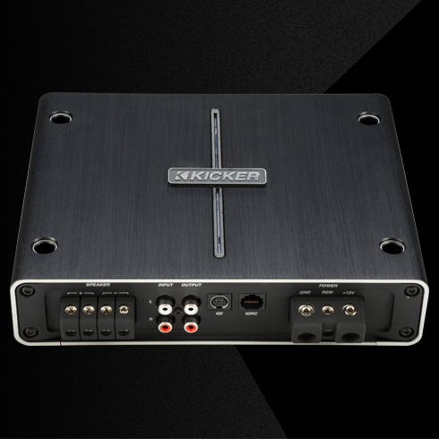 Rear view of KICKER IQ amplifier with speaker, input, output, and power connections.
