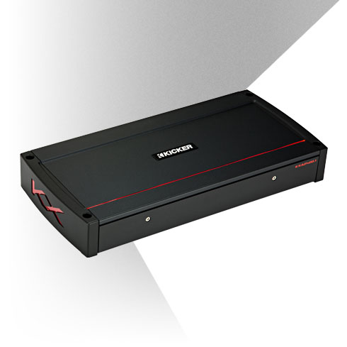 Angled view of KICKER amplifier with black housing, red accent lines, and KX logo side panel.