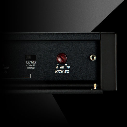 Close-up of KICKER amplifier control panel showing KickEQ+ bass boost knob.