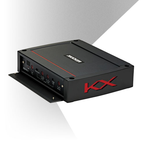 Angled view of KICKER KX amplifier with red accent lines, side KX logo, and open control panel cover.