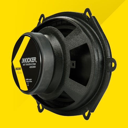 Back view of KICKER DSC680 6x8-inch coaxial car speaker with yellow and black label.