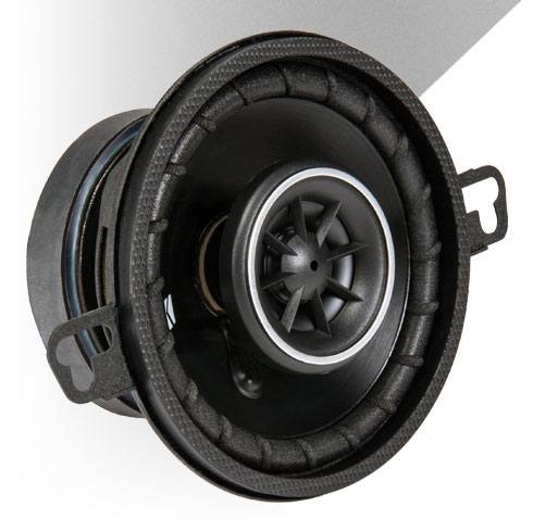 Close-up of a KICKER coaxial car speaker with PEI dome tweeter and ribbed surround design.